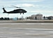 A UH-60 Black hawk helicopter from the Bismarck, North Dakota Army National Guard 285th Aviation Regiment, 2nd Battalion, Charlie Company, lifts off for an orientation flight with University of North Dakota Army Reserve Officer Training Course students on Oct. 31, 2015, from Grand Forks Air Force Base, North Dakota. The orientation flight was about a 20-minute trip which traveled around the local area. (U.S. Air Force photo by Senior Airman Xavier Navarro/Released)
