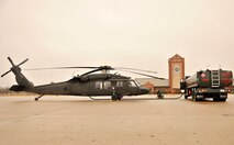 The 319th Logistics Readiness Squadron, Petroleum, Oil and Lubricants (POL) shop, fuel a UH-60 Black Hawk from Bismarck, North Dakota Army National Guard for an orientation flight for students from the North Dakota Army Reserve Officer Training Course Oct. 31, 2015, on Grand Forks Air Force Base, North Dakota. The POL shop help support the training exercise and orientation flight by fueling approximately 781 gallons of fuel into two of the Black hawk helicopters for students to fly around the local area. (U.S. Air Force photo by Senior Airman Xavier Navarro/Released)