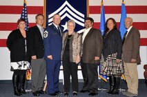 Chief Master Sgt. David Duncan, former 319th Air Base Wing command chief master sergeant, is pictured with his family Oct. 30, 2015, at his retirement ceremony at the base honor guard building on Grand Forks Air Force Base, North Dakota. Duncan is retiring after 30 years of service. (U.S. Air Force photo/Staff Sgt. Susan L. Davis)