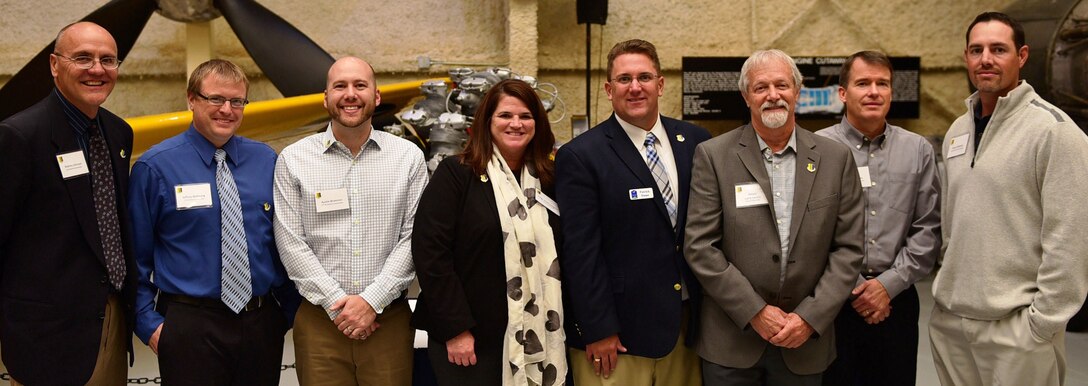 Eight business and civic leaders were inducted into the 28th Bomb Wing Honorary Commanders program during a special event at the South Dakota Air and Space Museum in Box Elder, S.D., Oct. 29, 2015. They include: Rodney Johnson, City of Rapid City Public Works Operations Management Engineer; Dr. Jeffrey Wehrung, Black Hills State University School of Business assistant professor; Austin Brummer, Armadillo's Ice Cream owner; Judge Heidi Linngren, Unified Judicial System circuit court judge; Patrick Dame, Rapid City Regional Airport executive director; Larry Larson, Box Elder mayor; Todd Seaman, South Dakota Department of Transportation region engineer; and Bryan Olmsted, New Wave Decking president. (U.S. Air Force photo by Airman 1st Class James L. Miller/Released)