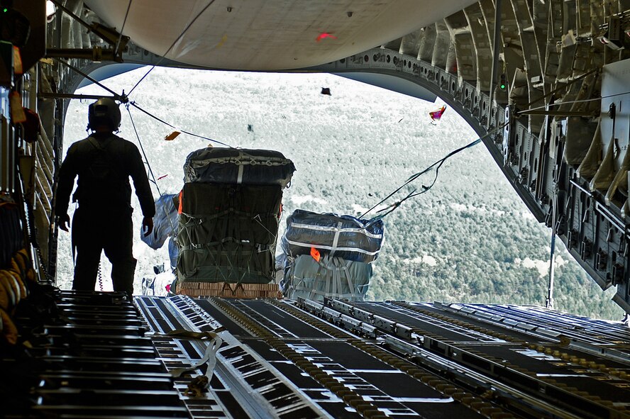 Cargo for the 82nd Airborne Division is air-dropped out the back of a C-17 Globemaster III, Oct. 29, 2015, over N.C., during a Joint Operation Access Exercise. The 82nd ABD is training as part of the Global Response Force, which is a joint force that can deploy and have servicemembers on the ground within 96-hours anywhere in the world on short notice. (U.S. Air Force photo/Senior Airman Divine Cox)