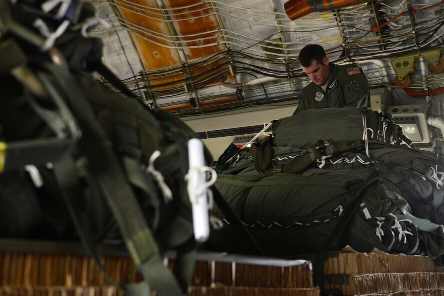 Staff Sgt. Eric Hachey, 8th Airlift Squadron loadmaster, checks the parachute of a Humvee before an air-drop Oct. 27, 2015, at Pope, Army Airfield, N.C., during a Joint Operation Access Exercise. Hatchey, alongside two other loadmasters, assisted in air dropping six Humvee’s from the 82nd Airborne Division. (U.S. Air Force photo/Senior Airman Divine Cox)