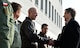 U.S. Air Force Lt. Col. Barry King II, 37th Airlift Squadron commander, greets U.S. Ambassador to Poland Paul W. Jones, during Jones’ visit to Powdiz Air Base, Poland, Oct. 29, 2015. Jones had the opportunity to meet with both U.S. and Polish air force leaders to discuss the countries’ growing partnership. The ambassador was also able to watch his first airlift competition, where C-130s from three different squadrons performed airdrops and landings. (U.S. Air Force photo/Senior Airman Damon Kasberg)