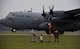U.S. and Polish airmen watch as a C-130H Hercules, assigned to the 182nd Airlift Wing performs a tactical landing as part of a friendly airlift competition during Aviation Detachment 16-1, Oct. 29, 2015, at Powidz Air Base, Poland. The aircrew able to land the closest to the center point is declared the winner. The Polish air force placed first. (U.S. Air Force photo/Senior Airman Damon Kasberg)