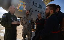 U.S. Air Force Capt. Joshua Fuller, left, 100th Operations Group instructor pilot, explains the KC-135 Stratotanker to Spanish air force members from the 49th Airbase Wing Oct. 23, 2015, at Son San Juan Air Base, Spain. Spanish and German military members were given the opportunity to fly aboard the KC-135 and witness the process of air refueling. Trident Juncture is one of many NATO exercises that provide a venue for current and, potentially, future NATO members to work on war fighting, communication and coordination skills.  (U.S. Air Force photo by Senior Airman Christine Halan/Released)