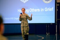 Tech. Sgt. Tawny Devine, 50th Space Wing chaplain’s assistant, briefs members of Team 5-0 about helping others in grief during Wingman University in the fitness center auditorium Tuesday, Oct. 27, 2015, at Schriever Air Force Base, Colorado. Wingman University class topics ranged from stress management to Thrift Savings Plans to sleep enhancement, and each supported the four pillars of Comprehensive Airman Fitness. (U.S. Air Force photo/Christopher DeWitt)