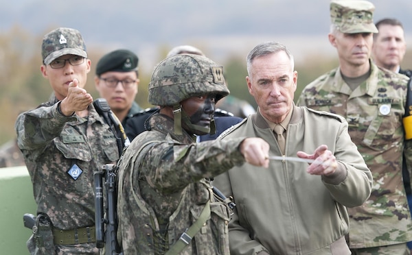 U.S. Marine Corps Gen. Joseph F. Dunford Jr., chairman of the Joint Chiefs of Staff, listens to a South Korean soldier brief him during a trip to the Demilitarized Zone in South Korea, Nov. 2, 2015. DoD photo by U.S. Navy Petty Officer 2nd Class Dominique A. Pineiro