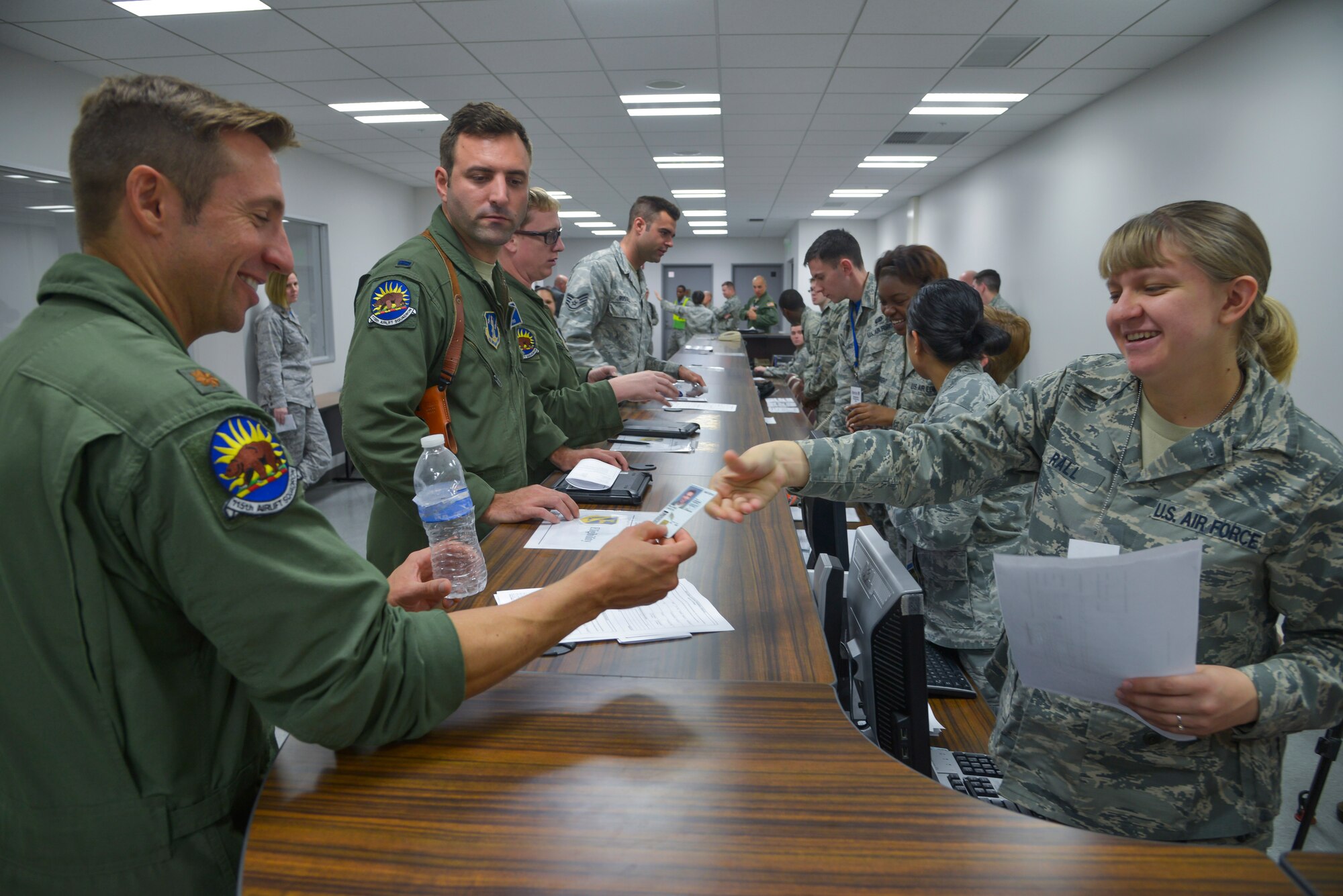 Airmen go through a reception line at Yokota Air Base, Japan, Oct. 30, 2015. The Airmen are assigned to the Alaskan Air National Guard 176th Wing and California Air National Guard 146th Airlift Wing. They traveled to Yokota to participate in Exercise VIGILANT ACE, a U.S. and Republic of Korea combined exercise aimed at enhancing operational and tactical level coordination through combined and joint combat training.  The exercise gave Yokota the opportunity to test its ability to receive and deploy forces throughout the theater. (U.S. Air Force photo by Senior Airman David Owsianka/Released)