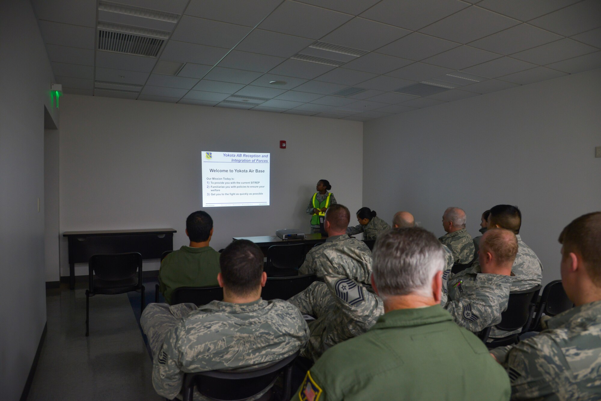 Airmen receive a reception and integration of forces briefing at Yokota Air Base, Japan, Oct. 30, 2015. The Airmen are assigned to the Alaskan Air National Guard 176th Wing and California Air National Guard 146th Airlift Wing. They traveled to Yokota to participate in Exercise VIGILANT ACE, a U.S. and Republic of Korea combined exercise aimed at enhancing operational and tactical level coordination through combined and joint combat training.  The exercise gave Yokota the opportunity to test its ability to receive and deploy forces throughout the theater. (U.S. Air Force photo by Senior Airman David Owsianka/Released)