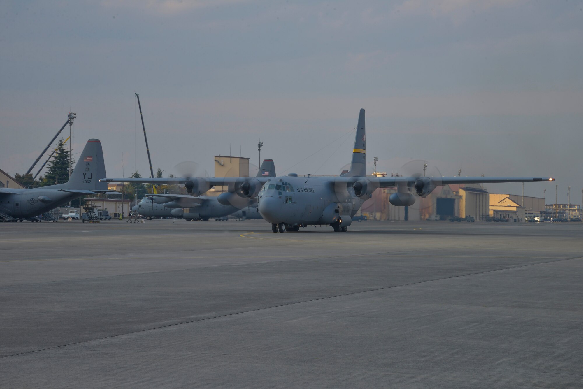 A C-130 Hercules, from the Alaskan Air National Guard 176th Wing, taxis on the runway at Yokota Air Base, Japan, Oct. 30, 2015. The C-130H and its crew traveled to Yokota to participate in Exercise VIGILANT ACE, a U.S. and Republic of Korea combined exercise aimed at enhancing operational and tactical level coordination through combined and joint combat training.  As the Western Pacific mobility hub, Yokota is a key hub in the event of regional instability and this exercise provided the base a chance to test those capabilities in a realistic scenario.  (U.S. Air Force photo by Senior Airman David Owsianka/Released)