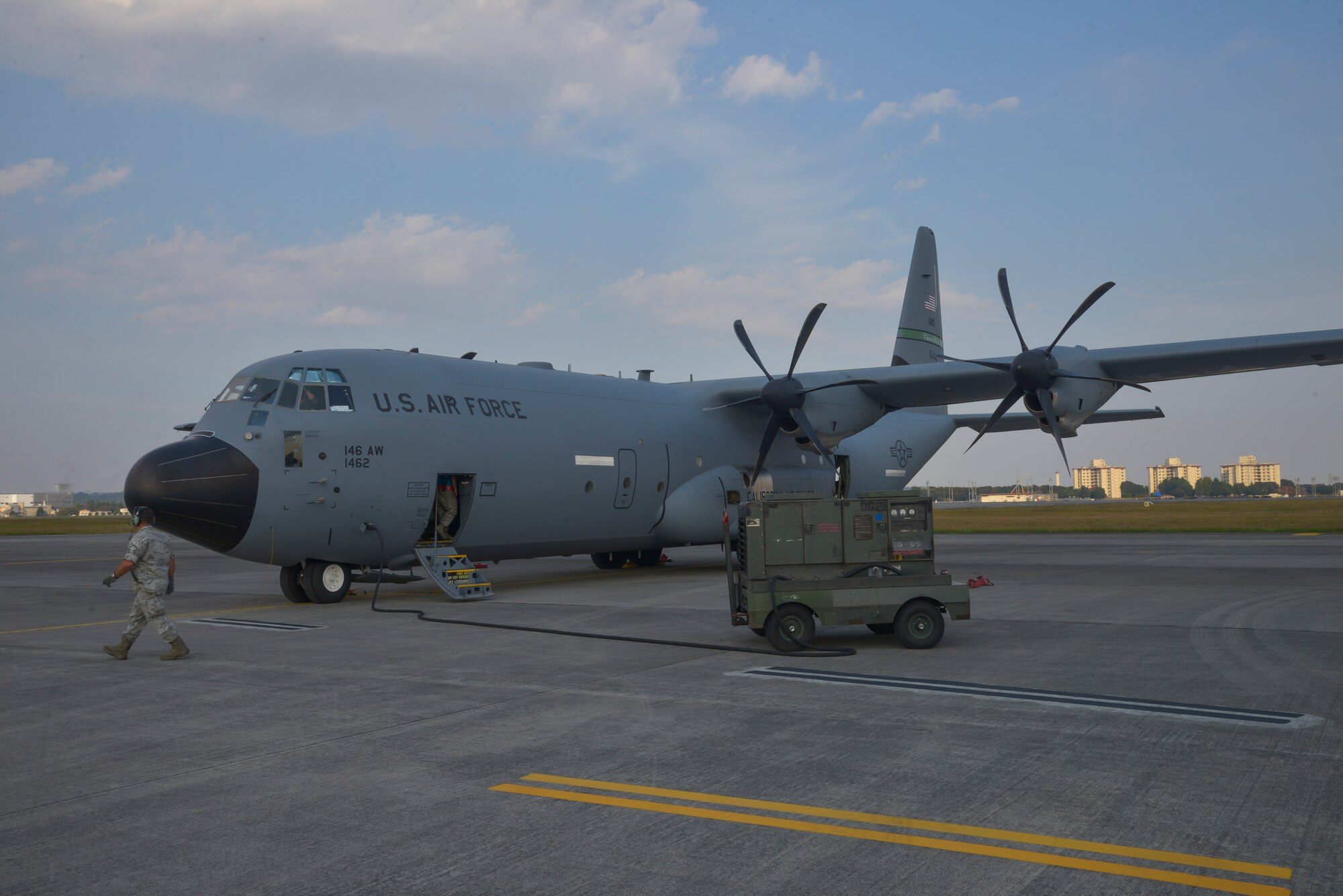 Airmen perform a post flight check on a C-130 Super Hercules, from the California Air National Guard 146th Airlift Wing, at Yokota Air Base, Japan, Oct. 30, 2015. The C-130J and its crew traveled to the region to participate in Exercise VIGILANT ACE, a large-scale exercise designed to enhance the interoperability of U.S. and Republic of Korea Air Forces.  The exercise allowed Yokota to test its ability to receive and deploy forces throughout the Indo-Asia Pacific Region. (U.S. Air Force photo by Senior Airman David Owsianka/Released)