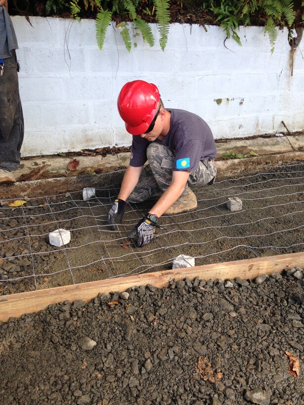 An Airman from the 36th Civil Engineer Squadron repairs a roadway during a Civil Action Team deployment to Palau in September. Multi-service units from multiple bases are improving Palauan’s lives by fixing the infrastructure, updating medical practices and implementing running water. (U.S Air Force courtesy photo)