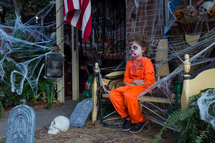 Ian, son of U.S. Air Force Tech. Sgt. Jedediah Hudgins, 23d Security Forces Squadron, awaits unsuspecting children to scare them while they trick or treat, Oct. 31, 2015, at Moody Air Force Base, Ga. The Hudgins family decorated their yard with a Halloween theme for trick or treaters to enjoy. (U.S. Air Force photo by Senior Airman Ceaira Tinsley/Released)