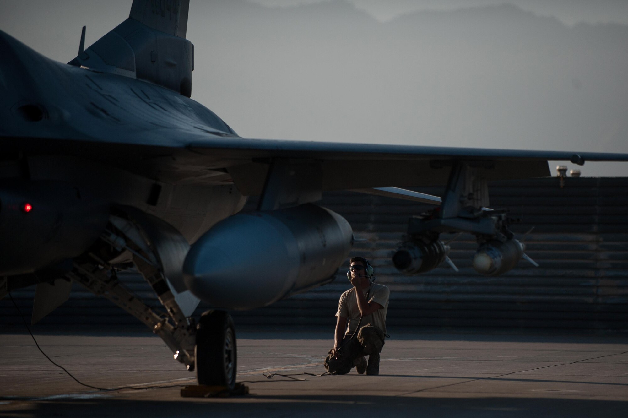 Airman 1st Class Christian Lamb, 455th Expeditionary Aircraft Maintenance Squadron crew chief, deployed from Aviano Air Base, Italy, performs a pre-flight inspection on an F-16 Fighting Falcon at Bagram Airfield, Afghanistan, Oct. 30, 2015. The 455th EAMXS ensure Fighting Falcons on Bagram are prepared for flight and return them to a mission-ready state once they land. (U.S. Air Force photo by Tech. Sgt. Joseph Swafford/Released)