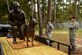 Staff Sgt. John Makripodis (left), 4th Security Forces Squadron kennel master, and Maj. Brent Gallant, 4th SFS commander, admire a War Dog Memorial statue, Oct. 27, 2015, at Seymour Johnson Air Force Base, North Carolina. Before reaching its permanent home at Veterans Memorial Park in Columbia, South Carolina, the statue traveled around North Carolina to all military installations for viewing. (U.S. Air Force photo/Airman Shawna L. Keyes)