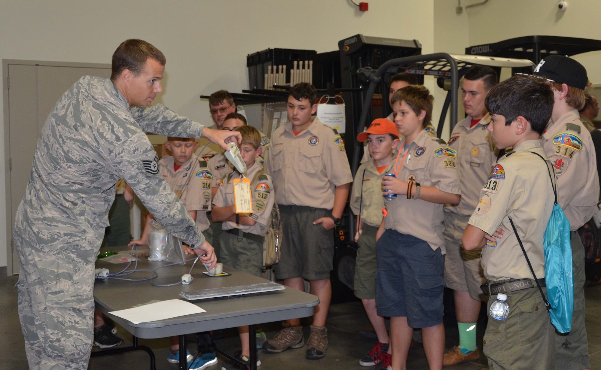 Tech. Sgt. Michael Stolp (left) displays survey instrumentation used to determine radiation exposure to a group of Boy Scouts who visited the Air Force Technical Applications Center Oct. 24, 2015.  The scouts were invited by the nuclear treaty monitoring center to learn more about nuclear science and help them earn a Nuclear Science Merit Badge.  (U.S. Air Force photo by Susan A. Romano)
