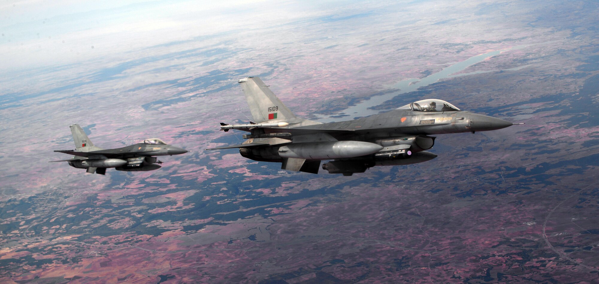 Portuguese air force F-16s fly over southern Spain, Oct. 23, 2015 as part of Exercise Trident Juncture 2015. Trident Juncture is one of many NATO exercises that provide a venue for current and, potentially, future NATO members to work on war fighting, communication and coordination skills. (U.S. Air Force photo by Senior Airman Christine Halan/Released)