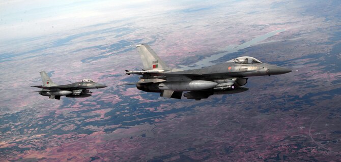 Portuguese air force F-16s fly over southern Spain, Oct. 23, 2015 as part of Exercise Trident Juncture 2015. Trident Juncture is one of many NATO exercises that provide a venue for current and, potentially, future NATO members to work on war fighting, communication and coordination skills. (U.S. Air Force photo by Senior Airman Christine Halan/Released)