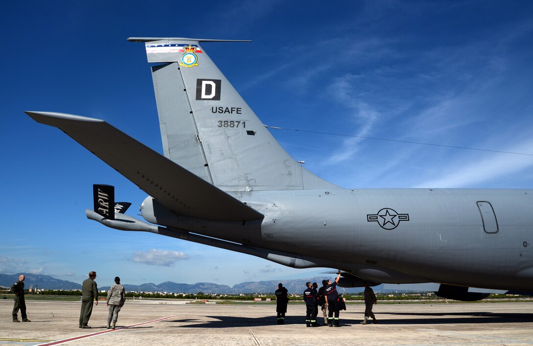 Spanish military firefighters, center, view the KC-135 Stratotanker, Oct. 23, 2015, at Son San Juan Air Base, Spain. The firefighters were given the opportunity to fly aboard the tanker to witness air refueling conducted by the 100th Air Refueling Wing as part of Exercise Trident Juncture 2015. The 100th ARW worked closely alongside German and Spanish military counterparts during the exercise. (U.S. Air Force photo by Senior Airman Christine Halan/Released)