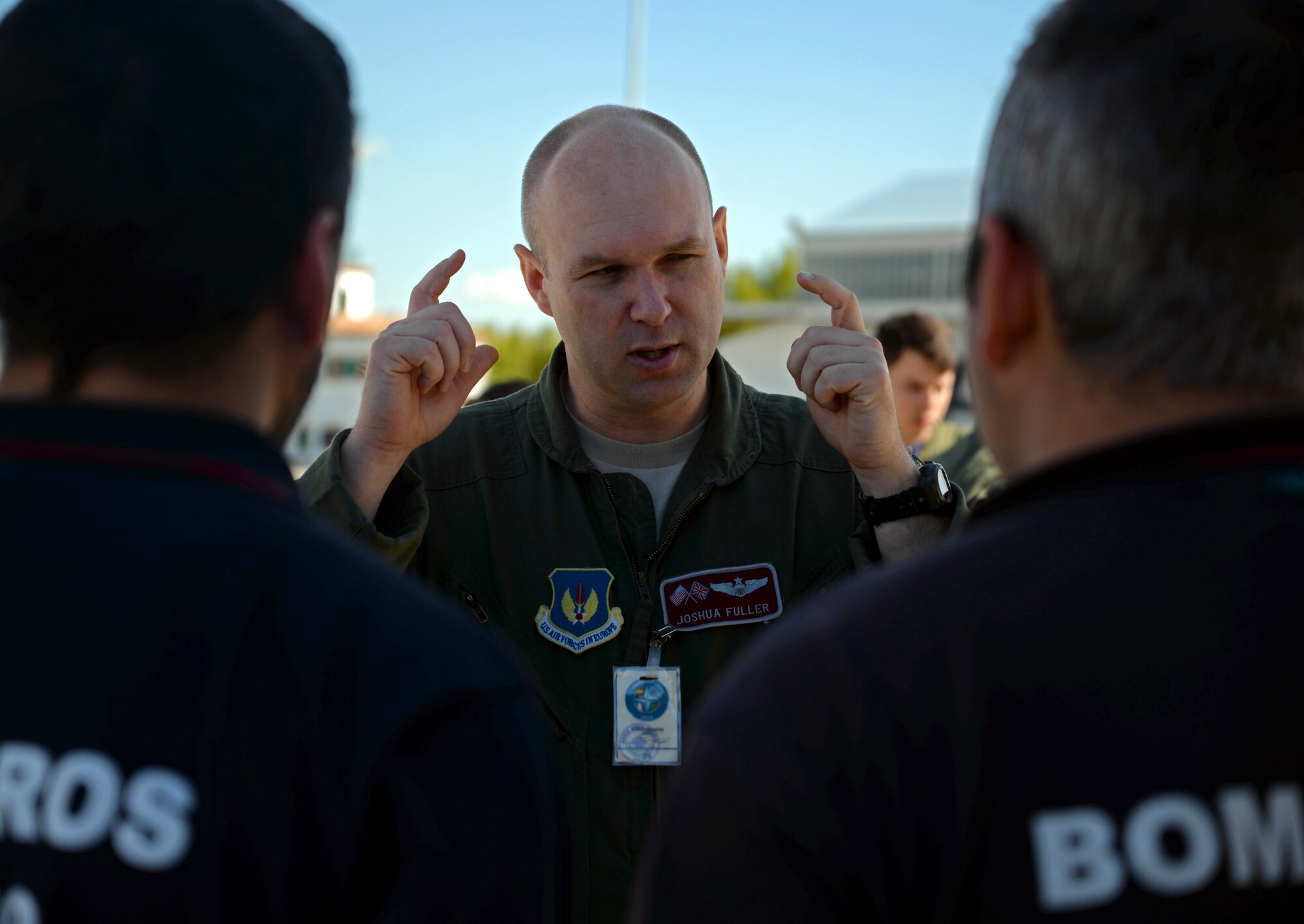 U.S. Air Force Capt. Joshua Fuller, 100th Operations Group instructor pilot, explains the headset to Spanish military firefighters prior to a flight, Oct. 23, 2015, at Son San Juan Air Base, Spain. The firefighters were given the opportunity to fly and watch air refueling conducted by the 100th Air Refueling Wing as part of Exercise Trident Juncture 2015. One of the primary objectives of the exercise is to demonstrate NATO’s visible assurance and NATO Force Response capabilities to tailor, plan, prepare, deploy and sustain forces. (U.S. Air Force photo by Senior Airman Christine Halan/Released)