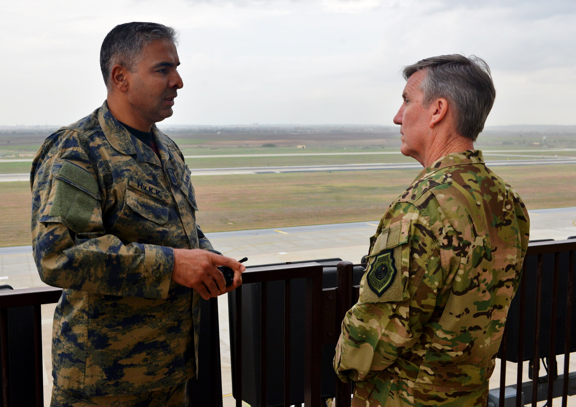 Brig. Gen. Bekir Ercan Van, 10th Tanker Base Command commander, discusses base operations with U.S. Air Force Gen. Hawk Carlisle, commander of Air Combat Command, during a base visit Oct. 22, 2015, at Incirlik Air Base, Turkey. As part of his visit, Carlisle met with both, U.S. and Turkish air forces leadership to learn more about their partnership at Incirlik AB. (U.S. Air Force photo by Senior Airman Michael Battles/Released)