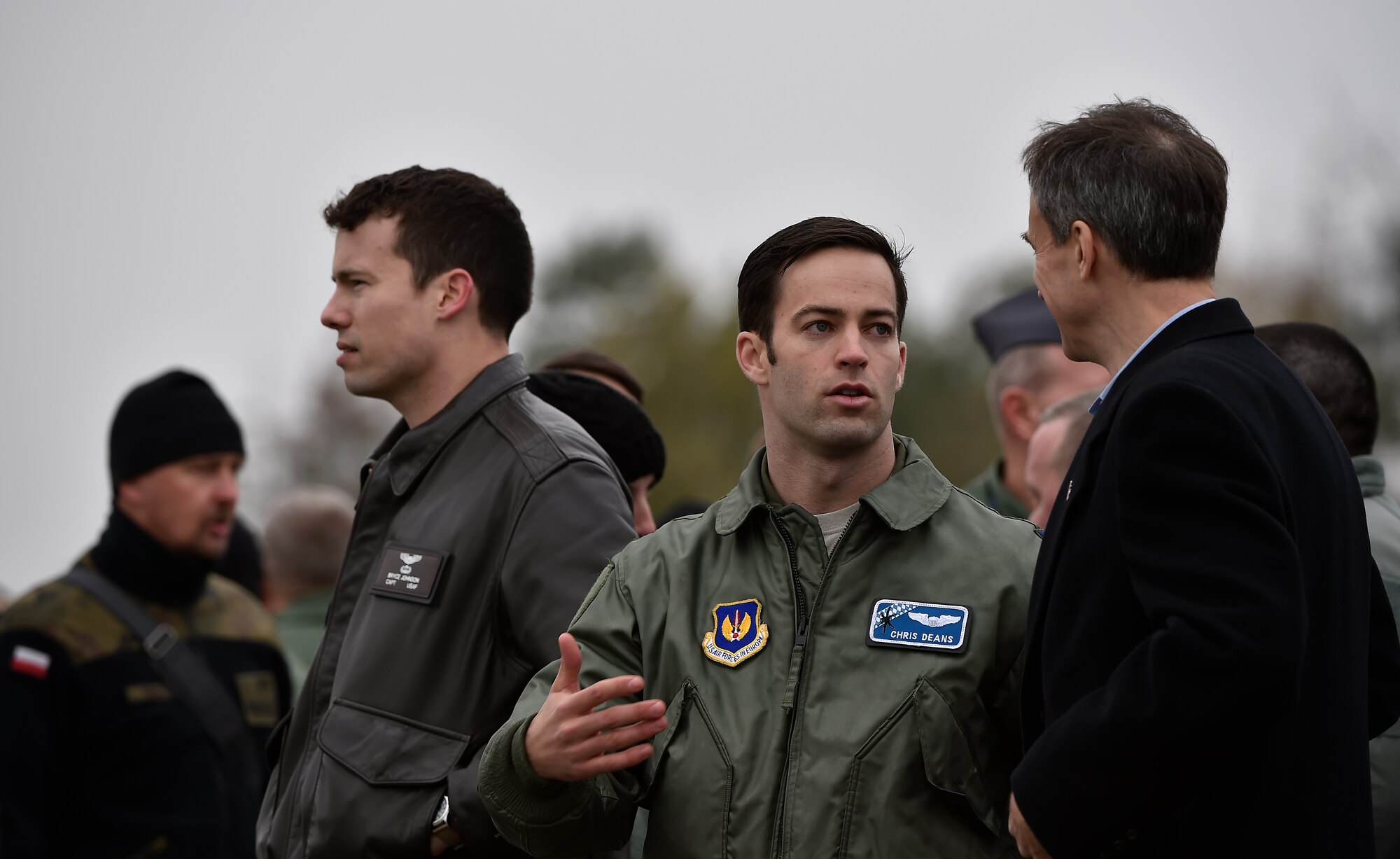 U.S. Air Force Capt. Chris Deans, 37th Airlift Squadron C-130J Super Hercules pilot, speaks to U.S. Ambassador to Poland Paul W. Jones during his visit to PowidzAir Base, Poland, Oct. 29, 2015. Jones had the opportunity to meet with both U.S. and Polish air force leaders to discuss the countries’ growing partnership. The ambassador was also able to watch his first airlift competition, where C-130s from three different squadrons performed airdrops and landings. (U.S. Air Force photo/Senior Airman Damon Kasberg)