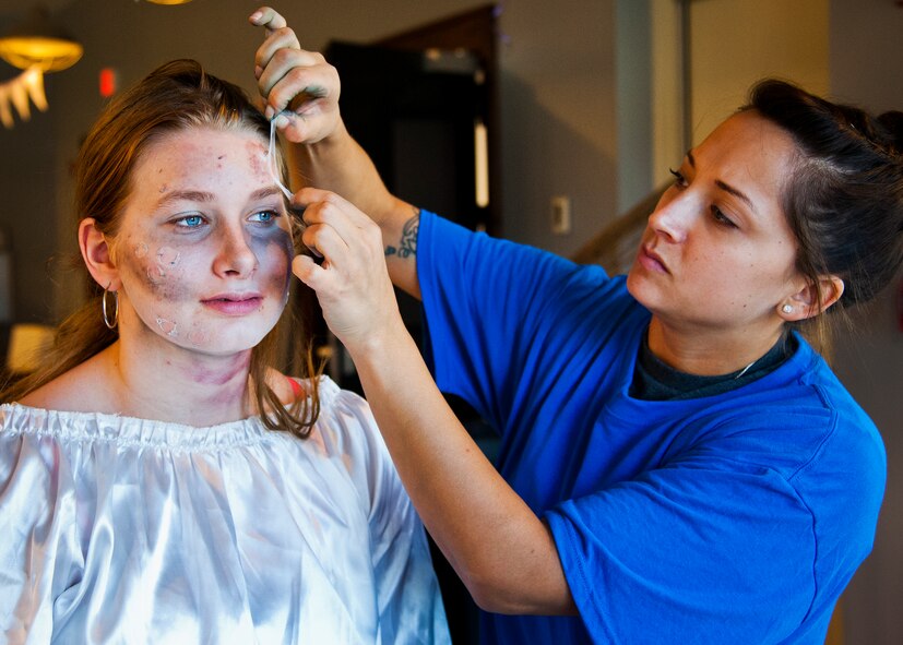 A volunteer gets turned into a zombie prior to the annual Zombie Stomp run Oct. 30 at Eglin Air Force Base, Fla.  More than 150 turned out to duck, dodge and outrun zombie hordes throughout the 5k run.  (U.S. Air Force photo/Samuel King Jr.)