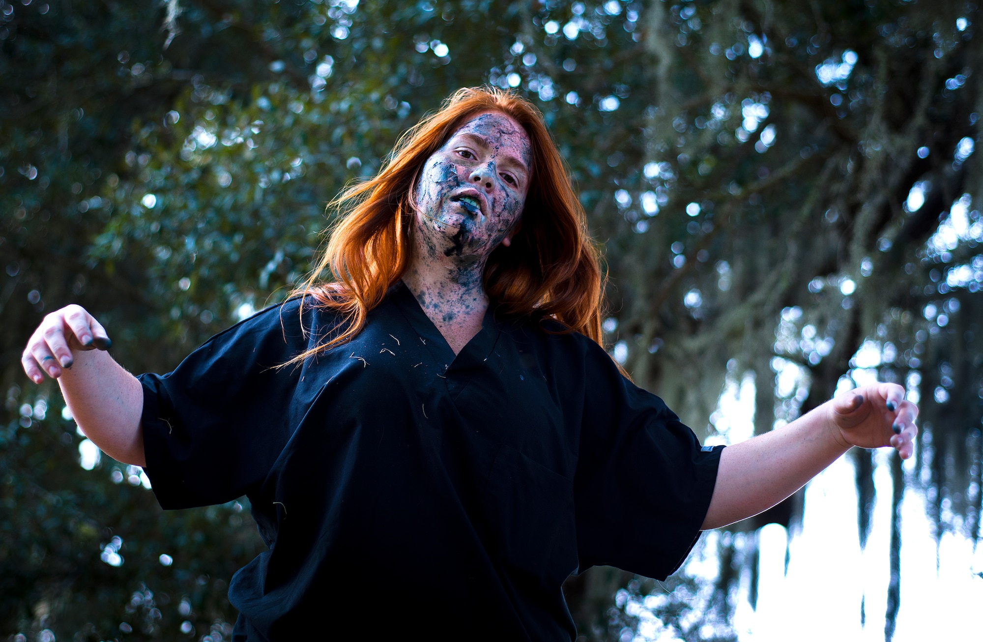 A walking dead practices her zombie walk prior to the annual Zombie Stomp run Oct. 30 at Eglin Air Force Base, Fla.  More than 150 turned out to duck, dodge and outrun zombie hordes throughout the 5k run.  (U.S. Air Force photo/Samuel King Jr.)