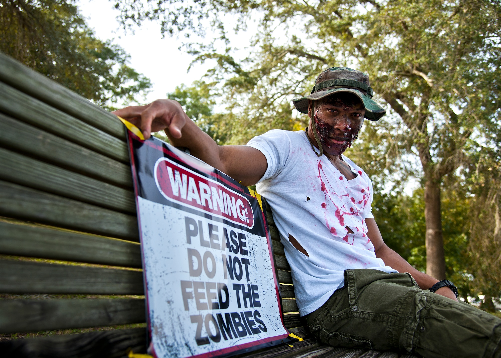A zombie hangs out waiting for some “dinner” prior to the annual Zombie Stomp run Oct. 30 at Eglin Air Force Base, Fla.  More than 150 turned out to duck, dodge and outrun zombie hordes throughout the 5k run.  (U.S. Air Force photo/Samuel King Jr.)