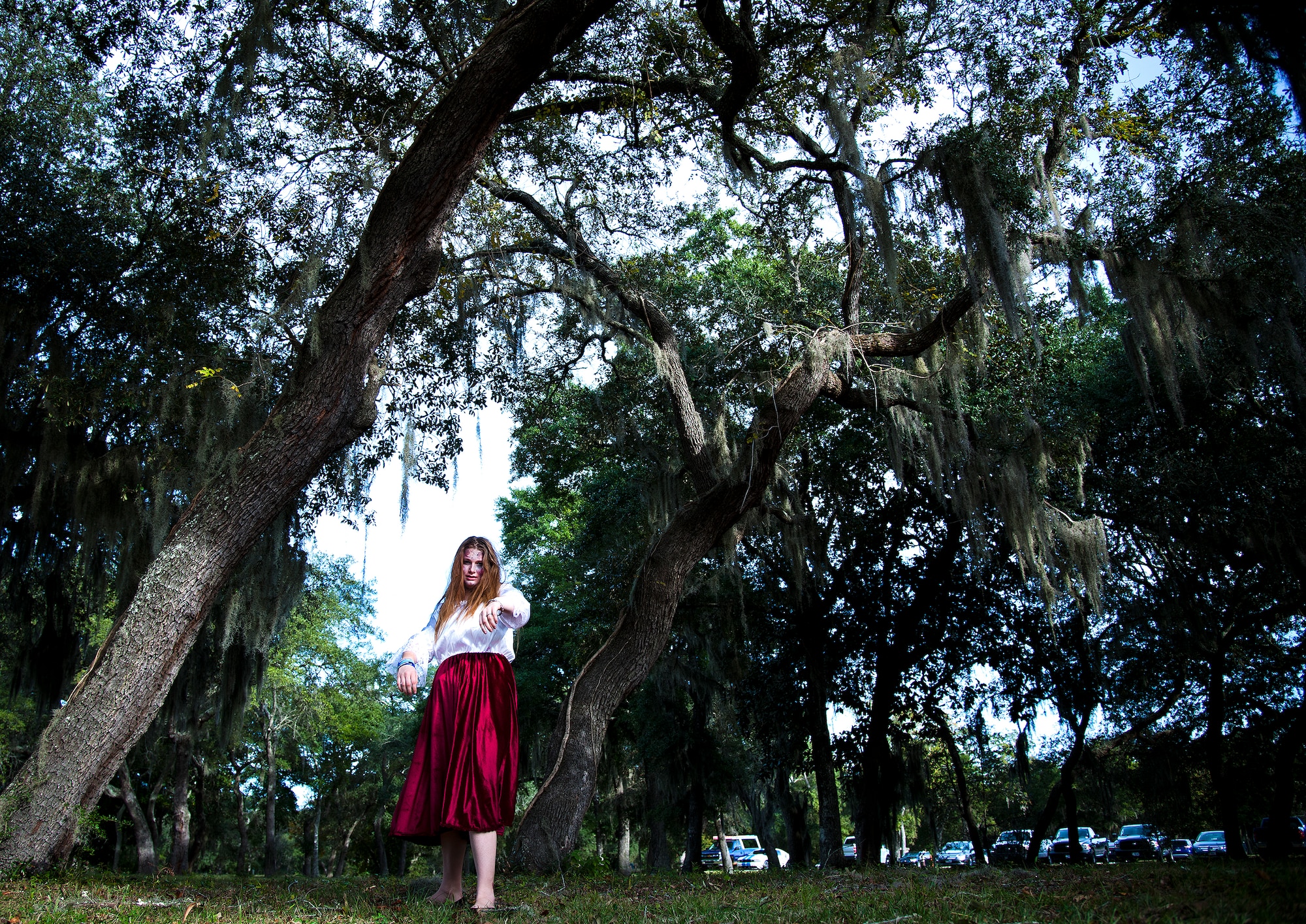 A walking dead practices her zombie walk prior to the annual Zombie Stomp run Oct. 30 at Eglin Air Force Base, Fla.  More than 150 turned out to duck, dodge and outrun zombie hordes throughout the 5k run.  (U.S. Air Force photo/Samuel King Jr.)