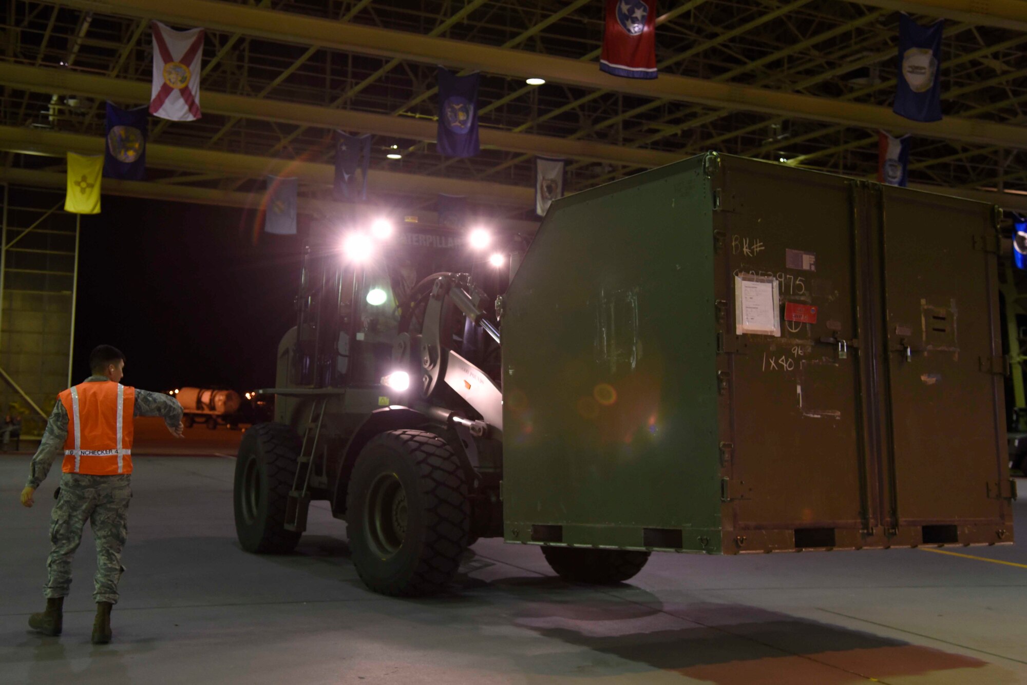 Airmen with the 35th Fighter Wing prepare cargo pallets for loading during exercise Beverly Sunrise 16-01 at Misawa Air Base, Japan, Nov. 1, 2015. Overseen by members from the 35th Logistics Readiness Squadron, augmentees packed cargo into the designated configuration appropriate for loading onto a C-130 Hercules aircraft. After loading was completed, cargo and personnel flew to Osan Air Base, South Korea, where both were utilized during the exercise. (U.S. Air Force photo by Airman 1st Class Jordyn Fetter/Released)