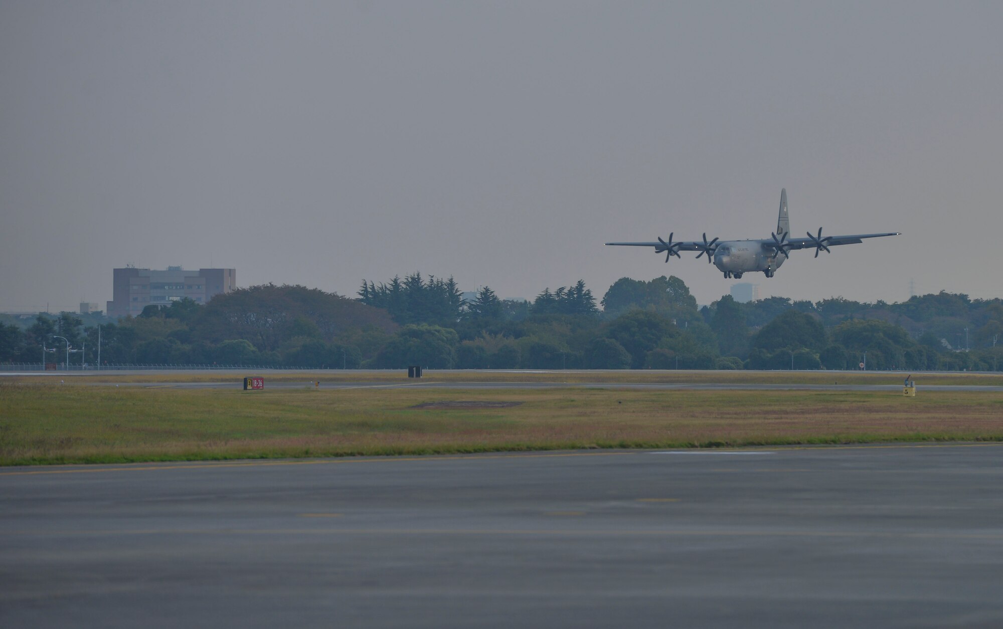 A C-130 Super Hercules, from the Alaskan Air National Guard 176th Wing, prepares to land at Yokota Air Base, Japan, Oct. 30, 2015. The C-130J and its crew traveled to the region to participate in Exercise VIGILANT ACE, a large-scale exercise designed to enhance the interoperability of U.S. and Republic of Korea Air Forces.  The exercise allowed Yokota to test its ability to receive and deploy forces throughout the Indo-Asia Pacific Region. (U.S. Air Force photo by Senior Airman David Owsianka/Released)