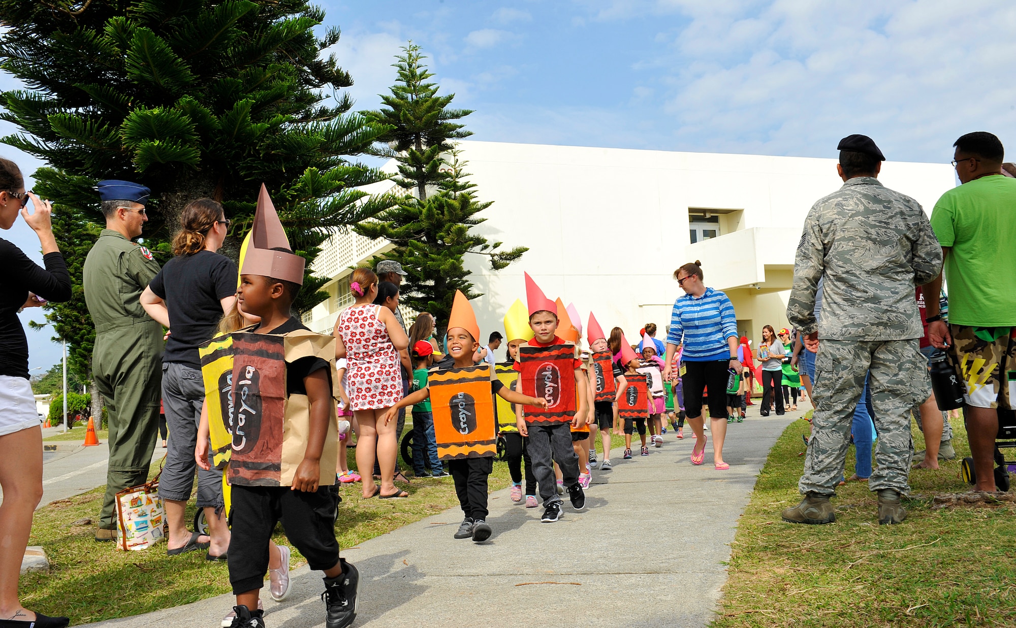 Stearley Heights Elementary School children receive applause by spectators during a storybook character parade Oct. 30, 2015, at Kadena Air Base, Japan. The parade was conducted to increase children's reading comprehension skills and to help them become proficient writers. (U.S. Air Force photo by Naoto Anazawa)