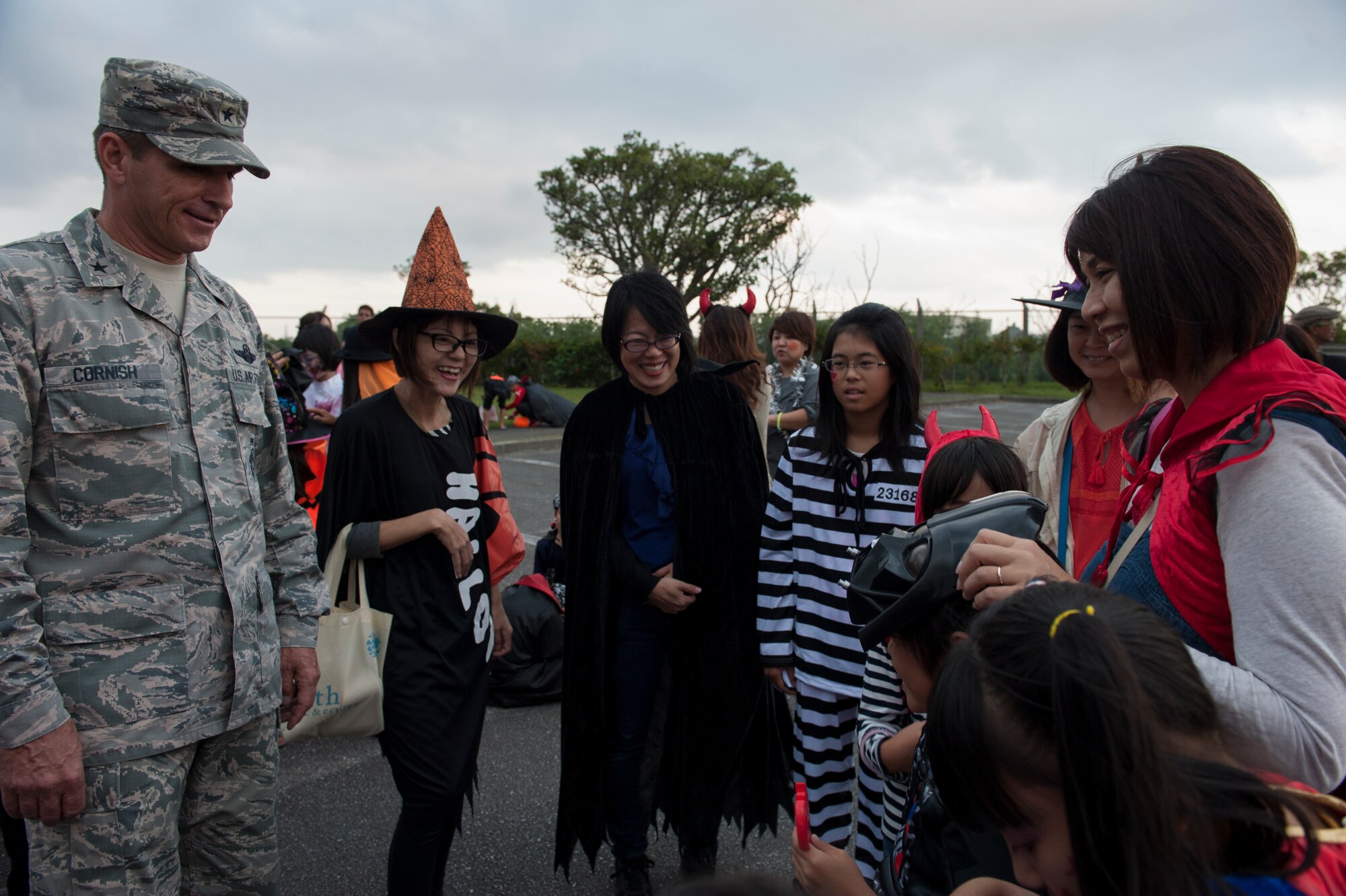 U.S. Air Force Brig. Gen. Barry Cornish, 18th Wing commander, comments on a local Okinawan’s Halloween costume Oct. 31, 2015, at Kadena Air Base, Japan. Kadena opened the base to local Okinawan families for the duration of a trick-or-treat event in celebration of Halloween. (U.S. Air Force photo by Airman 1st Class Lynette M. Rolen)