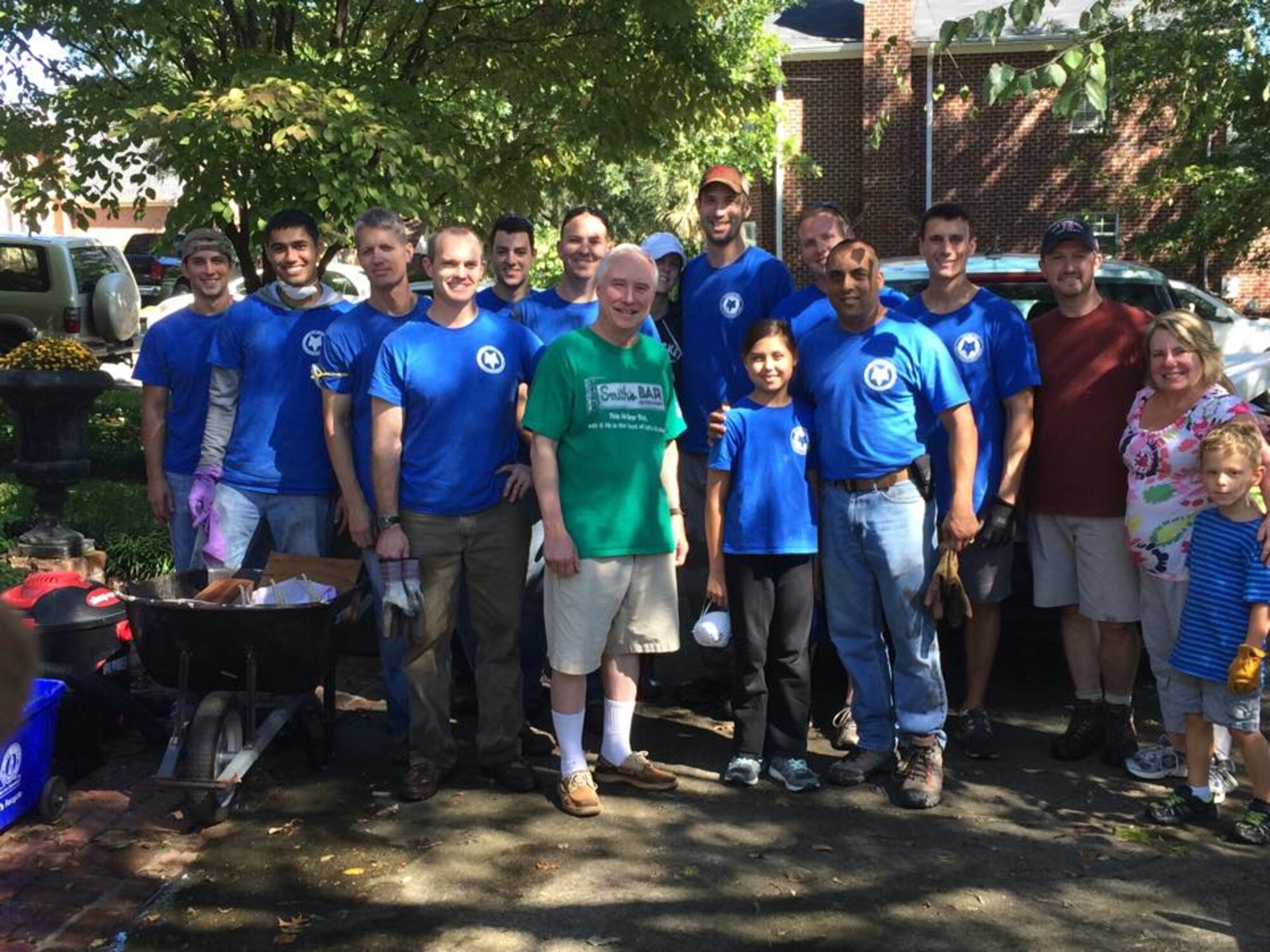 U.S. Airmen and family members from the 169th Fighter Wing, South Carolina Air National Guard, volunteer to provide assistance to residents in a Columbia neighborhood with the removal of household debris Oct. 8, 2015. The South Carolina National Guard has been activated to support state and county emergency management agencies and local first responders as historic flooding impacts counties statewide. Currently, more than 2,900 South Carolina National Guard members have been activated in response to the floods. (U.S. Air National Guard courtesy photo/Released)