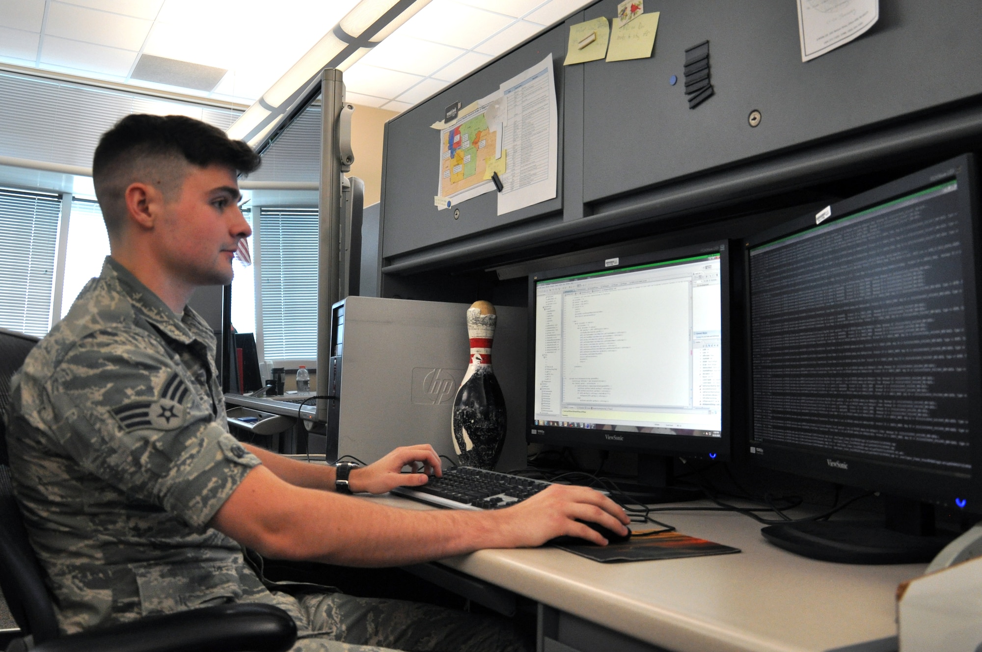 Senior Airman Ryan Childs, 2d Systems Operations Squadron alphanumeric collections software technician, writes a computer program Oct. 20 at the 557th Weather Wing, Offutt Air Force Base, Nebraska. Childs is from Huntsville, Alabama, and followed in his brother’s footsteps by joining the military. (U.S. Air Force photo by Staff Sgt. Rachelle Blake/Released)