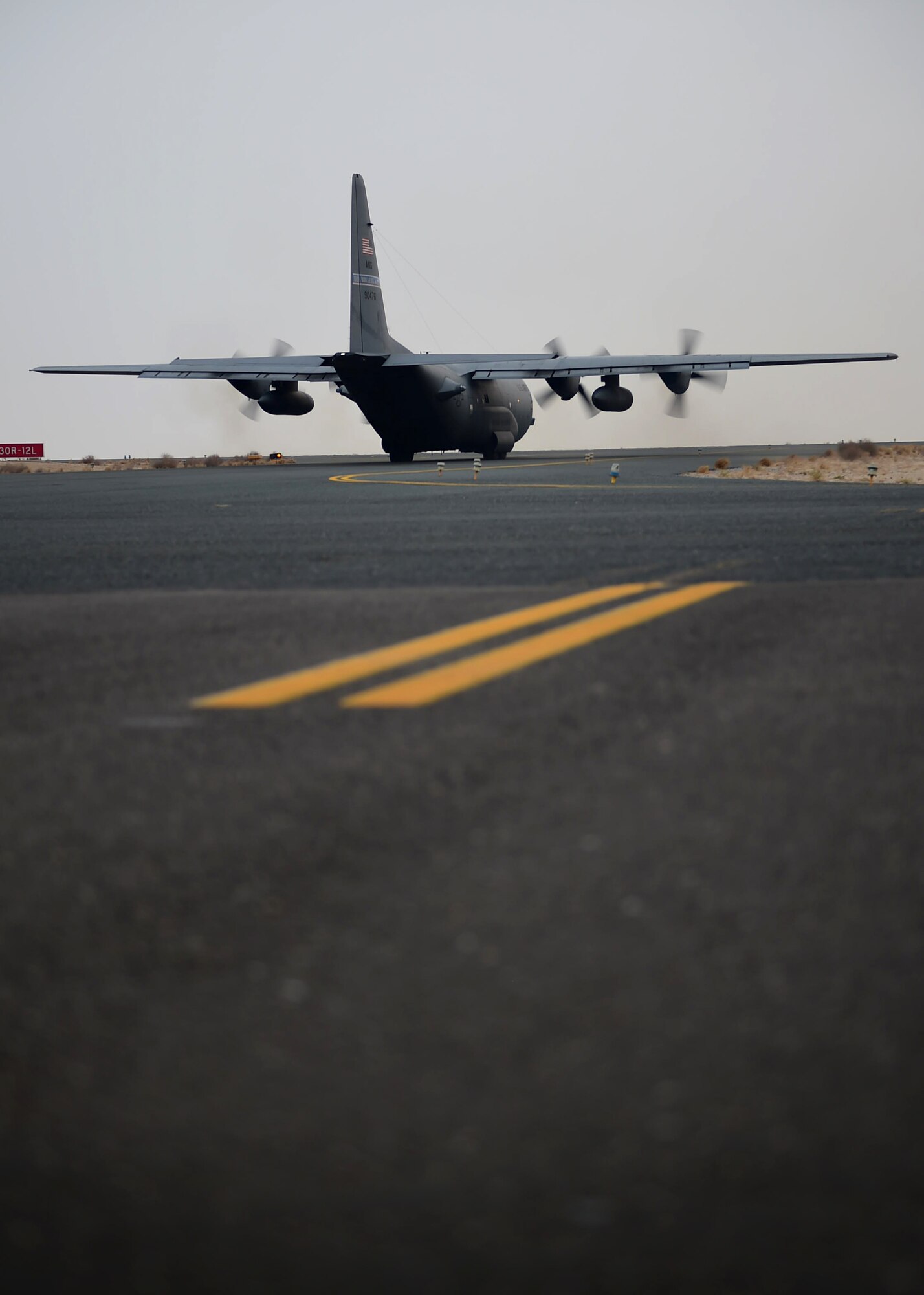 A C-130H Hercules taxis down the runway prior to takeoff at an undisclosed location in Southwest Asia, Oct. 29, 2015. More than two hundred Airmen from the 165th Airlift Wing based out of Savannah, Georgia and the 192nd Airlift Squadron based out of Reno, Nevada deployed to provide support for Operation INHERENT RESOLVE. (U.S. Air Force photo by Staff Sgt. Jerilyn Quintanilla)