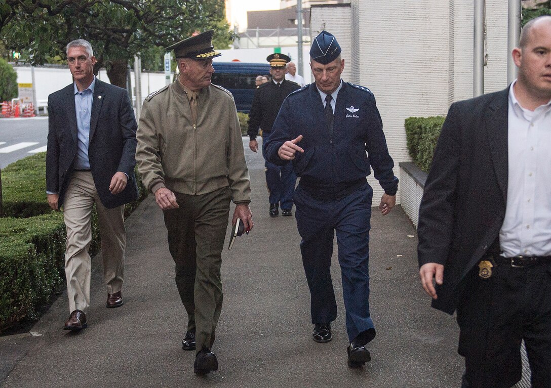 U.S. Marine Corps Gen. Joseph F. Dunford Jr., chairman of the Joint Chiefs of Staff, listens to U.S. Air Force Lt. Gen. John L. Dolan, commander, U.S. Forces Japan, during a walk through Tokyo following a meeting with U.S. Ambassador to Japan Caroline Kennedy in Tokyo, Nov. 3, 2015. DoD photo by U.S. Navy Petty Officer 2nd Class Dominique A. Pineiro