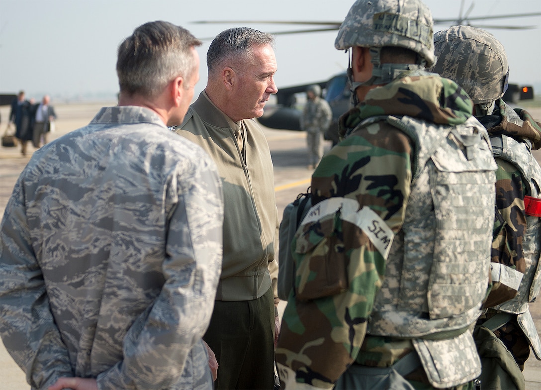 U.S. Marine Corps Gen. Joseph F. Dunford Jr., chairman of the Joint Chiefs of Staff, speaks with U.S. Air Force Lt. Gen. Terrence O'Shaughnessy, commander, 7th Air Force and Air Component Command U.S. Forces Korea/U.S. Combined Forces, as well as soldiers and airmen on Osan Air Base, South Korea, before departing to Japan, Nov. 3, 2015.  DoD photo by U.S. Navy Petty Officer 2nd Class Dominique A. Pineiro