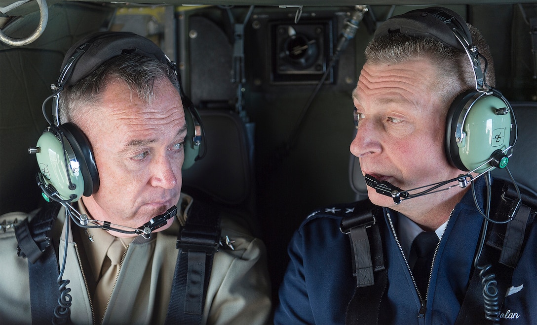 U.S. Marine Corps Gen. Joseph F. Dunford Jr., left, chairman of the Joint Chiefs of Staff, listens to U.S. Air Force Lt. Gen. John L. Dolan, commander, U.S. Forces Japan, during a helicopter ride from Yokota Air Base to meet with Caroline Kennedy, U.S. Ambassador to Japan, in Tokyo, Nov. 3, 2015. DoD photo by U.S. Navy Petty Officer 2nd Class Dominique A. Pineiro