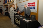 Army Brig. Gen. Charles R. Hamilton, commander of DLA Troop Support greets a vendor from the Federal Occupational Health organization at the AbilityOne Day expo Oct. 28 in Philadelphia. The event was held to increase awareness of the outstanding contributions people with disabilities have made to our nation and to highlight the products and services provided to our warfighters.