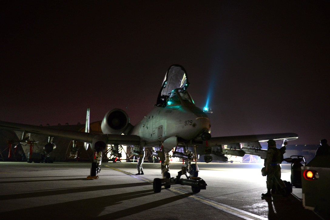 U.S. airmen conduct systems checks and prepare an A-10 Thunderbolt II for night operations during Vigilant Ace 16 on Osan Air Base, South Korea, Nov. 2, 2015. The large-scale employment exercise increases interoperability and enhances U.S. and South Korea commitments to maintain peace in the region. The airmen are assigned to the 25th Fighter Squadron. U.S. Air Force photo by Staff Sgt. Amber Grimm