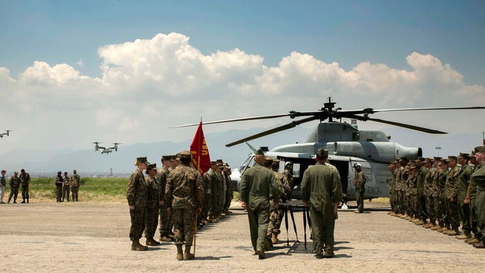 Two MV-22B Ospreys with Joint Task Force 505 return from delivering relief supplies to Jiri Village during the dignified transfer of six U.S. Marines and two Nepalese soldiers at Tribhuvan International Airport in Kathmandu, Nepal, May 17, 2015. JTF 505 conducting Operation Sahayogi Haat continues to honor their fallen service members by carrying on with their original humanitarian aid mission to help Nepalese civilians still suffering from 7.8 and 7.3 magnitude earthquakes that struck the region April 25 and May 12, respectively.