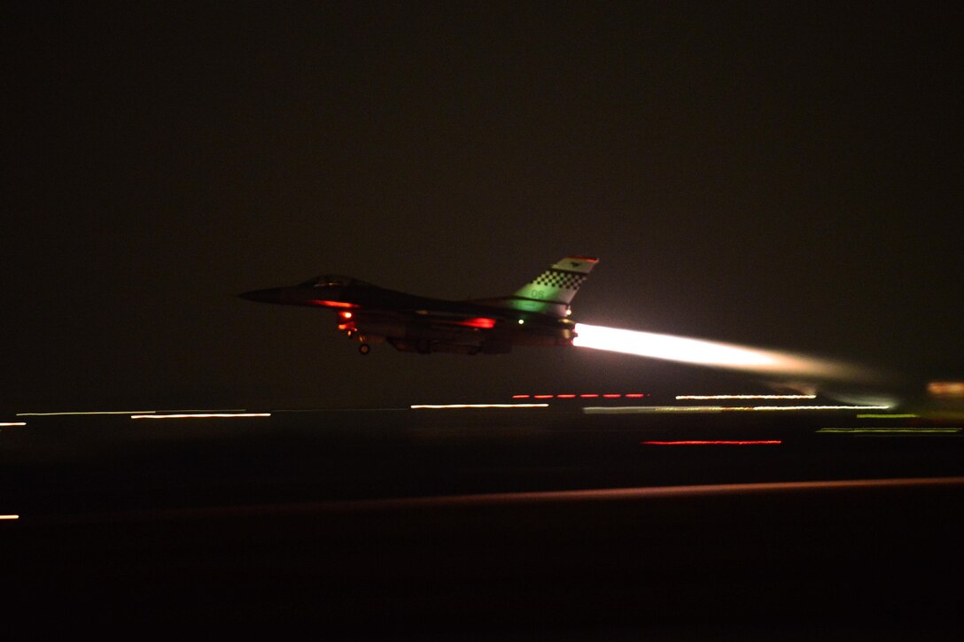 An F-16 Fighting Falcon aircraft screams down the runway and takes off for night operations during Vigilant Ace 16 on Osan Air Base, South Korea, Nov. 2, 2015. U.S. Air Force photo by Staff Sgt. Amber Grimm