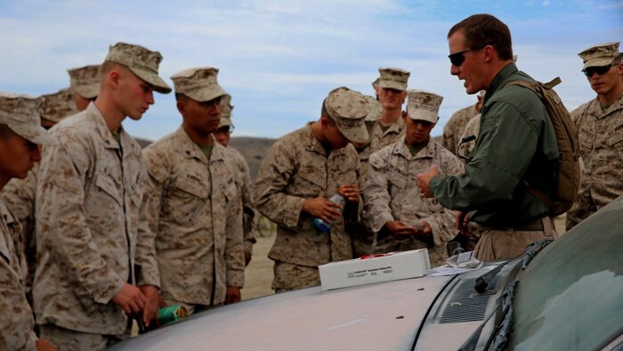 An instructor with the Marine Corps Engineer Society teaches Marines with Headquarters and Service Company, 1st Battalion, 5th Marine Regiment, 1st Marine Division, how to inspect for hazardous chemicals during searchers and site exploitation training aboard Marine Corps Base Camp Pendleton, Calif., Oct. 27-29, 2015. The three-day training period provided 1/5 personnel with instruction on how to identify threats within a designated area and conduct systematic searches using appropriate detection equipment.