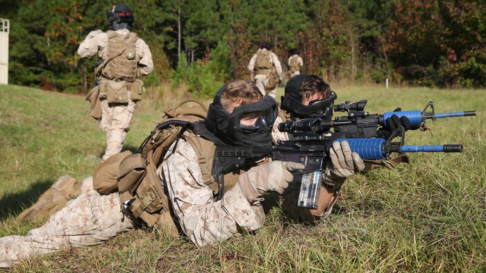 Two Marines with 1st Battalion, 6th Marine Regiment maintain security during the Basic Urban Skills Training course at Marine Corps Base Camp Lejeune, N.C., Oct. 30, 2015. The BUST Course trains Marines to perform multiple combat operations on urban environments. 