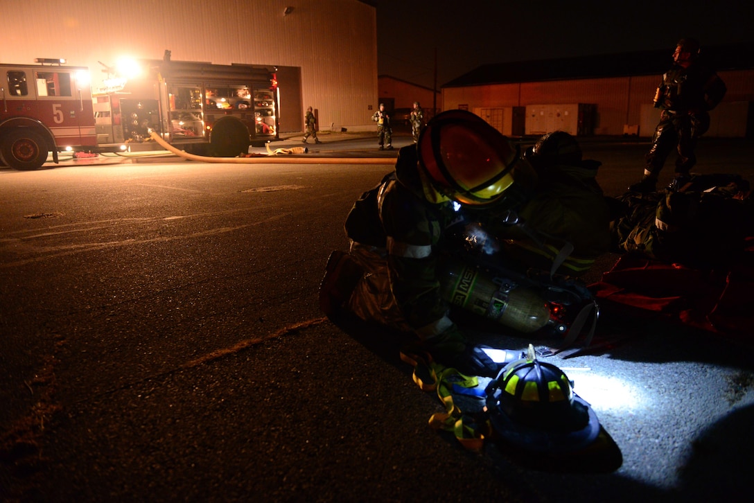 U.S. airmen perform first aid on a simulated casualty during a mock building fire, part of Vigilant Ace 16 on Osan Air Base, South Korea, Nov. 3, 2015. U.S. Air Force photo by Staff Sgt. Amber Grimm