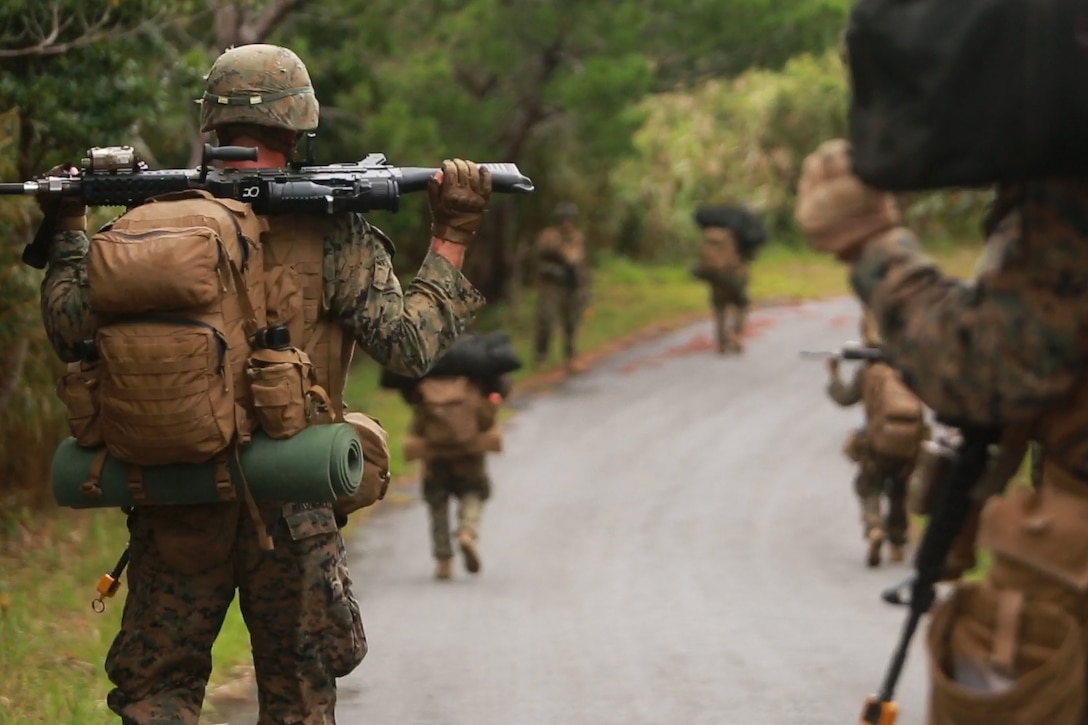 U.S. Marines patrol through the Jungle Warfare Training Center on Okinawa, Japan, Oct. 31, 2015, as part of an air assault during Blue Chromite 2016. U.S. Marine Corps photo by Cpl. Drew Tech 