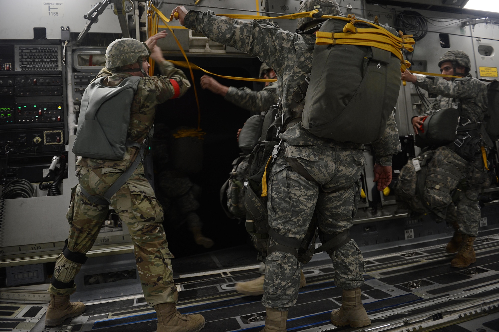 Soldiers from the 82nd Airborne Division jump out of a C-17 Globemaster III, Oct. 28, 2015, over North Carolina during Joint Operation Access Exercise 16-1. The JOAX was designed to enhance service cohesiveness between Army and Air Force personnel, allowing both services an opportunity to execute equipment and personnel drops. (U.S. Air Force photo/Senior Airman Divine Cox)