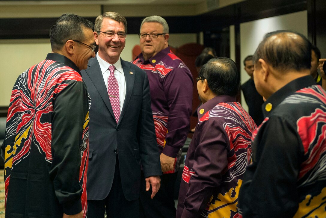 U.S. Defense Secretary Ash Carter shares a light moment with members of the Association of Southeast Asian Nations to discuss matters of mutual importance during the group's Defense Ministers Meeting Plus in Kuala Lumpur, Malaysia, Nov. 3, 2015. Carter plans to meet with leaders from more than a dozen nations across East Asia and South Asia to help advance the next phase of the U.S. military’s rebalance in the region by modernizing longtime alliances and building new partnerships. DoD photo by U.S. Air Force Senior Master Sgt. Adrian Cadiz